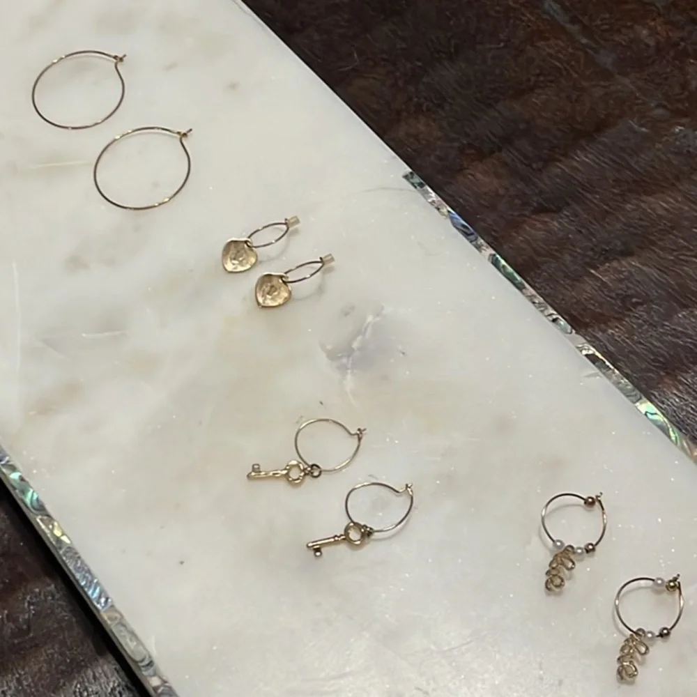 Charming Charlie gold tone four pairs of hoop Love, key and lock earrings bundle